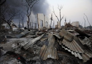 A burnt house is seen in Meikhtila