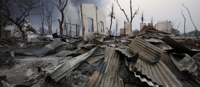 A burnt house is seen in Meikhtila