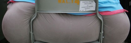 Obese person sitting on chair