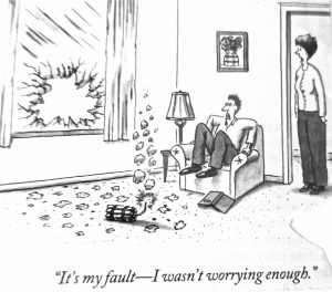 Cartoon depicting a man sitting on a couch with a broken window and a bomb on the floor, while a woman stands nearby.