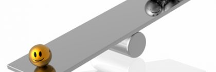 A silver seesaw with a gold smiley face on one side and several silver frowning faces on the other side.