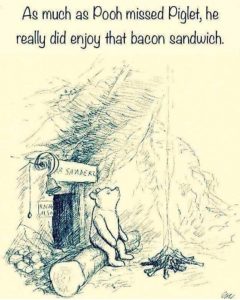 Winnie the Pooh sitting on a log with a bacon sandwich, looking thoughtful in a forest setting.