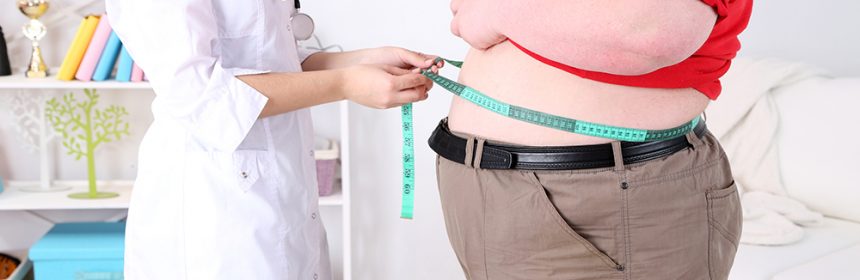 Doctor examining patient obesity on light background
