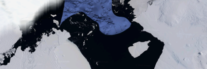 Aerial image showing a contrast of ice formations and dark water in Antarctica.